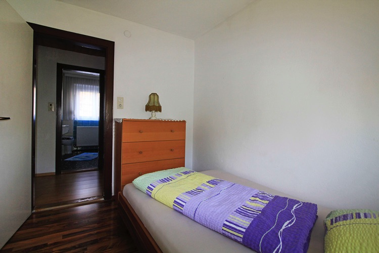 Wohnung Gertrud - Schlafzimmer mit Einzelbett